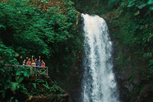 Travelers in Costa Rica enjoying the beatiful waterfalls